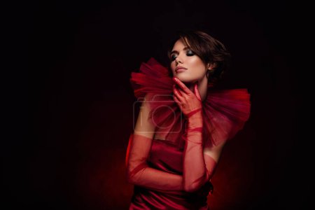 Photo for Tenderness passionate young lady posing for high fashion magazine vogue dressed red vintage trend vip gown mysterious. - Royalty Free Image