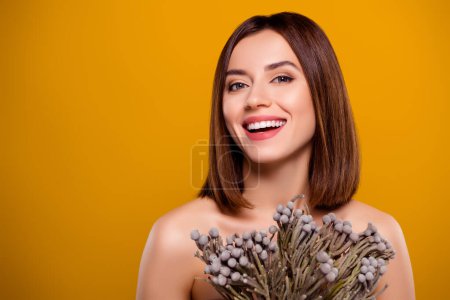 Photo for Studio portrait young girl cover her body use exotic bunch dry reed flowers take care hydration level skin oil control. - Royalty Free Image