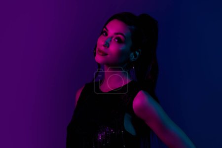 Photo for Photo of classy lady celebrate valentine day in futurism modern nightclub on neon glowing vivid color background. - Royalty Free Image
