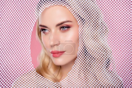 Photo for Photo of attractive lady look from white net capture searching for exit escape isolated pastel color background. - Royalty Free Image