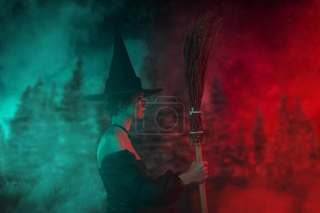 Photo for Banner image collage of mysterious lady witch holding broom stick flight magic dark woods mist on green red lights. - Royalty Free Image