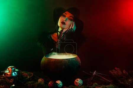 Photo for Photo of lady warlock doing love potion in cauldron feel dreamy about enchant gothic king over neon background. - Royalty Free Image