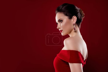 Photo for Photo of dreamy adorable woman nude shoulders dress looking empty space isolated red maroon color background. - Royalty Free Image