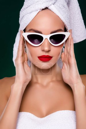 Photo for Vertical photo of luxurious lady wrapped in hotel white towel wear retro cat eye sunglass morning bride routine. - Royalty Free Image