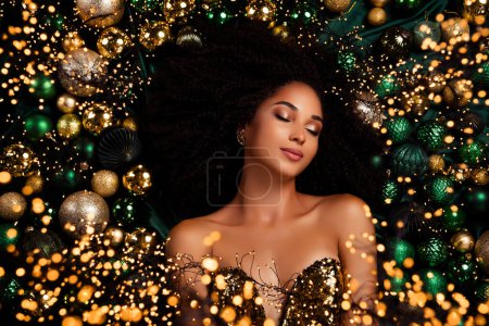 Photo for Top view photo of stunning charming lady wish dream christmas prepsent lying toy balls tinsels glitter sparkles. - Royalty Free Image