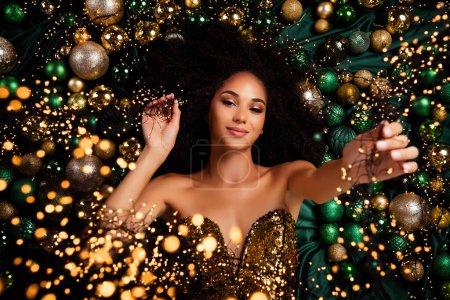 Photo for Top view photo of gorgeous stunning girl hold lights tinsels advertise tradition event occasion christmas preparation. - Royalty Free Image