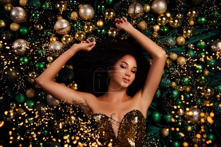Photo for Top view flatlay photo of charming lady laying on christmas decor for new year event occasion. - Royalty Free Image