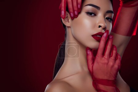 Photo for Photo of stunning asian woman femme fatale touch lips seduce romantic shoulders off isolated dark red color background. - Royalty Free Image