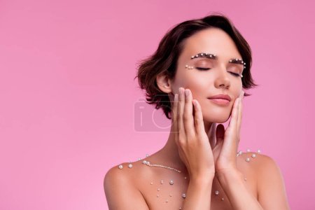 Photo for Photo of rich lady touch face after hygiene daily routine applying organic gel with pearls ingredient. - Royalty Free Image