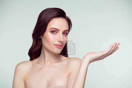 Photo for Photo portrait of lovely young lady palm hold empty space spa salon isolated on light gray color background. - Royalty Free Image