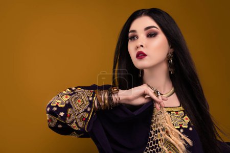 Photo for Photo of gorgeous pretty lady hold national arabian scarf dancing for rich royal sultan party over pastel background. - Royalty Free Image