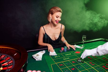 Photo for Photo of attractive chic girl entertainment in las vegas casino club make stakes risk for incredible slot jackpot. - Royalty Free Image