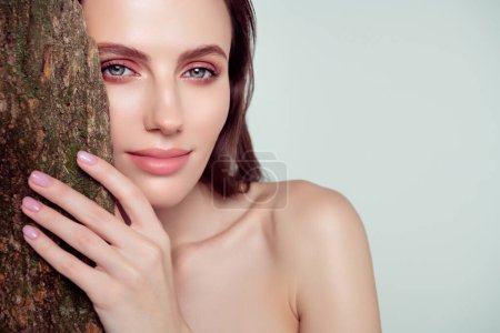 Photo for Photo of attractive stunning gorgeous girl hide over oak tree enjoy bio alternative cosmetology products. - Royalty Free Image