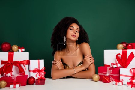 Photo for Photo of fancy chic lady prepare gift box for family friends enjoy christmas celebration over green color background. - Royalty Free Image