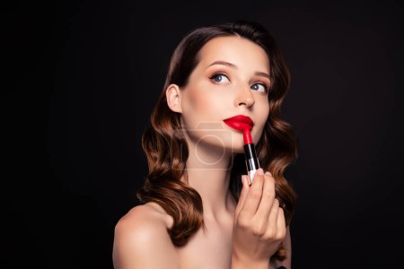 Photo for Photo of classy pretty lady beautician applying new brand cosmetics beauty promo over dark color background. - Royalty Free Image