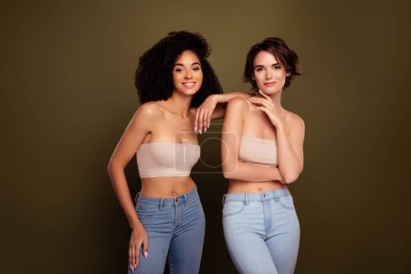 Photo for Natural beauty concept of two slender fit models charming passionate ladies posing isolated on khaki color background. - Royalty Free Image