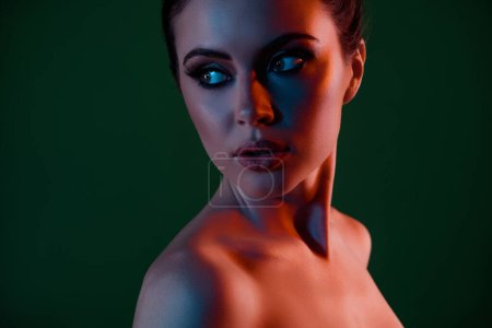 Photo for Close up photo of hot passionate girl look dark green neon empty space background feel curious beauty promotion. - Royalty Free Image
