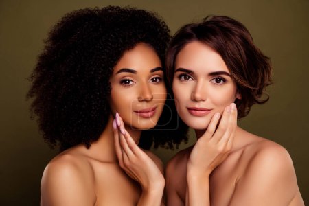 Photo for Aesthetic portrait of two pretty charming girls hands touch cheek pure skin isolated on khaki color background. - Royalty Free Image