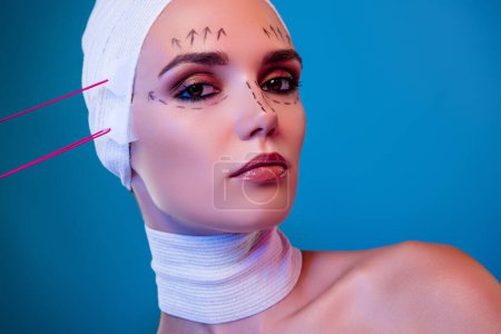 Photo for Close up photo of charming lady plastic surgery patient having tape lifting procedure over neon color background. - Royalty Free Image