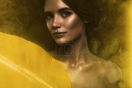 Photo for Creative artwork template collage of sensual beauty woman shiny glitter body golden leaves extract essence lotion. - Royalty Free Image