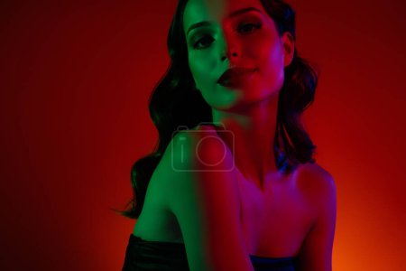 Photo for Photo of hot flirt lady in red color neon night club disco feel attractive to marry millionaire guy. - Royalty Free Image
