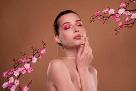 Photo for Photo of stunning gorgeous lady touch enjoy soft fresh facial skin after applying tradition japanese oriental balm. - Royalty Free Image