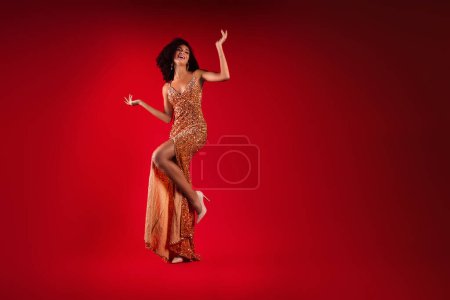 Photo for Photo of cheerful lovely elegant lady on high fashion week ceremony festival over red gradient color background. - Royalty Free Image