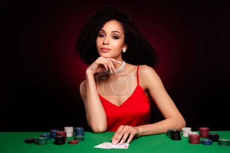 Photo for Photo of stunning chic lady risky playing with best poker player bet fortune isolated over dark red color background. - Royalty Free Image