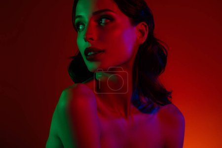 Photo for Photo of curious hot attractive charming girl look red neon empty space futuristic cosmetology therapy offer. - Royalty Free Image
