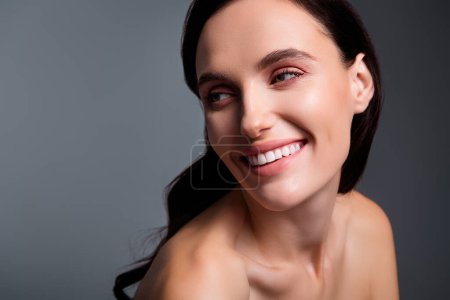 Photo for Photo of joyful smiling woman with brunette curls look empty space isolated grey color background. - Royalty Free Image