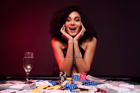 Photo for Photo of happy excited girl celebrate corporate party in private poker club playing bet stakes win incredible jackpot. - Royalty Free Image
