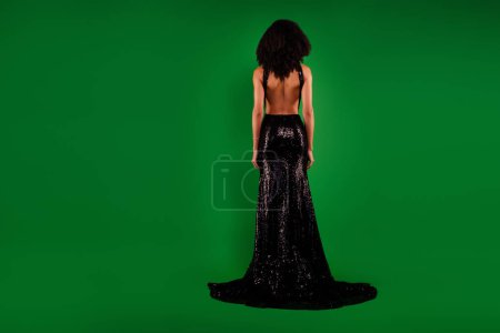 Photo for Rear view photo of stunning lovely luxurious lady with naked back wear elegant dress on green color background. - Royalty Free Image