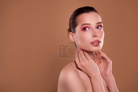 Photo for Photo of pretty high fashion lady touch skin body after luxury therapy beauty salon offer on brown empty space. - Royalty Free Image