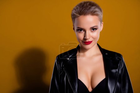 Photo for Photo attractive lady chic in leather jacket dressed tempting black brassiere isolated on pastel brown color background. - Royalty Free Image
