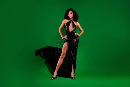 Photo for Photo of adorable classy lovely lady famous singer in black glowing dress isolated over green gradient color background. - Royalty Free Image