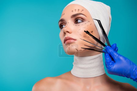 Photo for Photo of lady patient prepare for plastic surgery examine by doctor with medical tools over cyan background. - Royalty Free Image