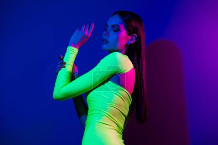 Photo for Profile photo of lovely peaceful model girl touch hand posing isolated on multicolor neon background. - Royalty Free Image