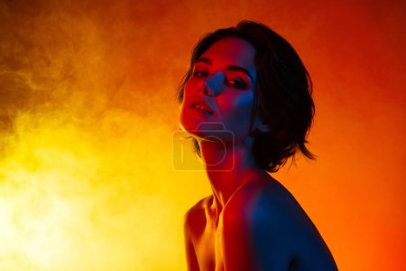 Photo for Photo of sweet adorable woman naked shoulders arms hands cheekbone isolated red neon color background. - Royalty Free Image