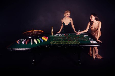Photo for Photo of attractive chic celebrate bachelorette event in night las vegas party playing lucky win million jackpot. - Royalty Free Image