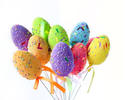 Photo for The bright multi-colored Easter eggs isolated on white background. Happy Easter Greeting card with copy space for text. The minimal concept. - Royalty Free Image