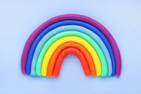 Photo for Colorful rainbow of plasticine on blue background. Made from plasticine. Isolate. - Royalty Free Image
