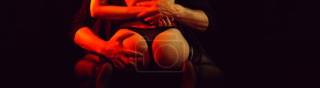 Photo for Passionate foreplay between a man and a girl. Male hands wildly squeeze the girls ass. Panoramic wide horizontal photo for banner head cover - Royalty Free Image
