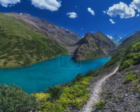 Photo for Panorama landscape with a blue lake in the mountains in summer. Koksai Ainakol Lake in Tien Shan Mountains in Asia in Kazakhstan - Royalty Free Image