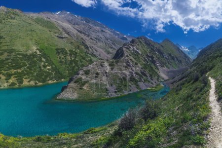Photo for Panorama landscape with a blue lake in the mountains in summer. Koksai Ainakol Lake in Tien Shan Mountains in Asia in Kazakhstan - Royalty Free Image