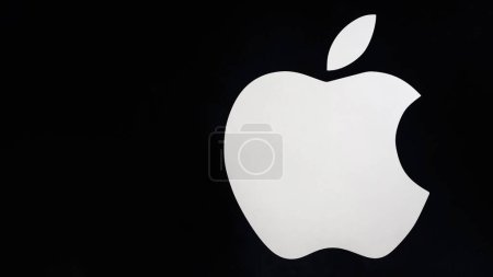 Photo for SHYMKENT, KAZAKHSAN - JANUARY 23, 2023: Apple logo on a black background on the wall of an electronics store - Royalty Free Image