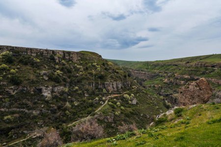 Panoramic view of Aksu canyon with blue water in the spring river in Kazakhstan
