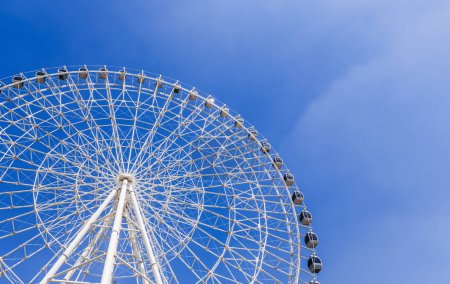 white big Ferris wheel on background a blue sky in the amusement park Navryz in Tashkent in Uzbekistan with copy space