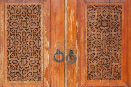 traditional Arabic Uzbek Islamic patterns arabesque ornament on an vintage wooden carved door in Uzbekistan