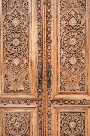 carved wooden door with oriental pattern Uzbek ornament in the Museum of Victims of Political Repression in Tashkent close-up