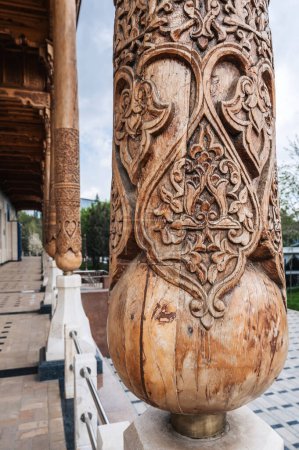 carved wooden column with oriental islamic pattern Uzbek ornament in the Museum of Political Repression in Tashkent close-up